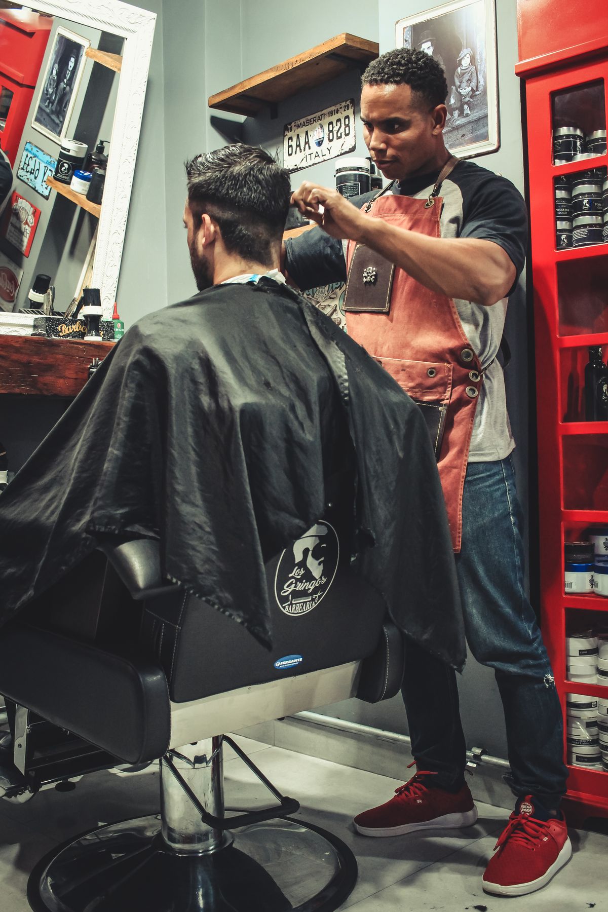 A barber at work (licensed stock placeholder — not this shop)
