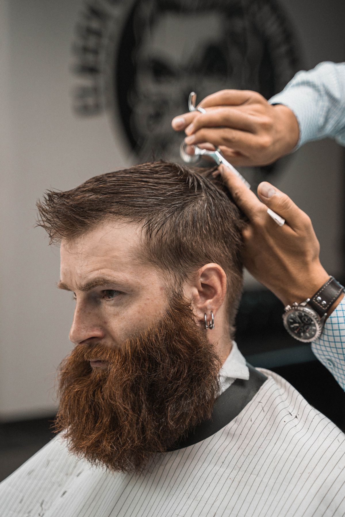 A barber at work (licensed stock placeholder — not this shop)
